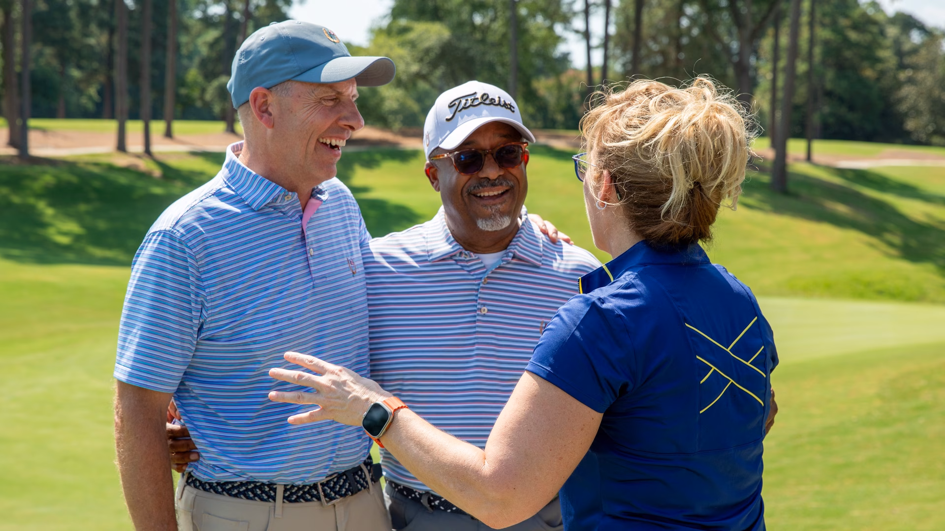 Rhonda Khabir, Keith Jackson, and John Kueser enjoy the festivities at the opening of The Shoe