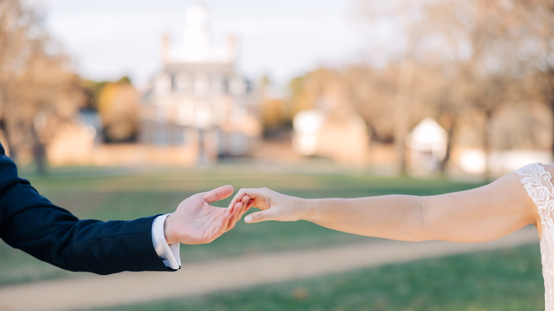 Wedding Day Holding Hands in front of the Palace