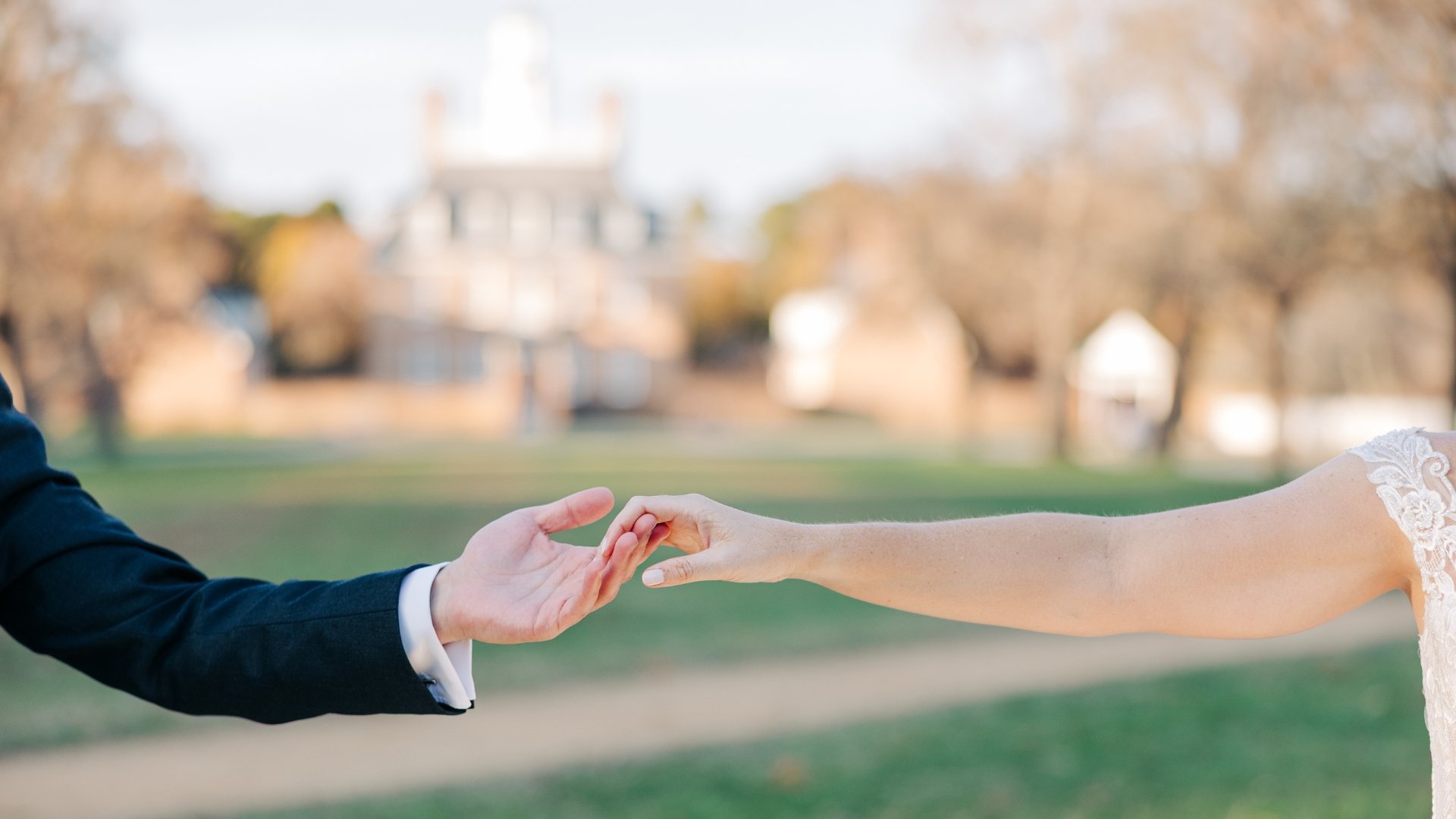 Wedding Day Holding Hands in front of the Palace