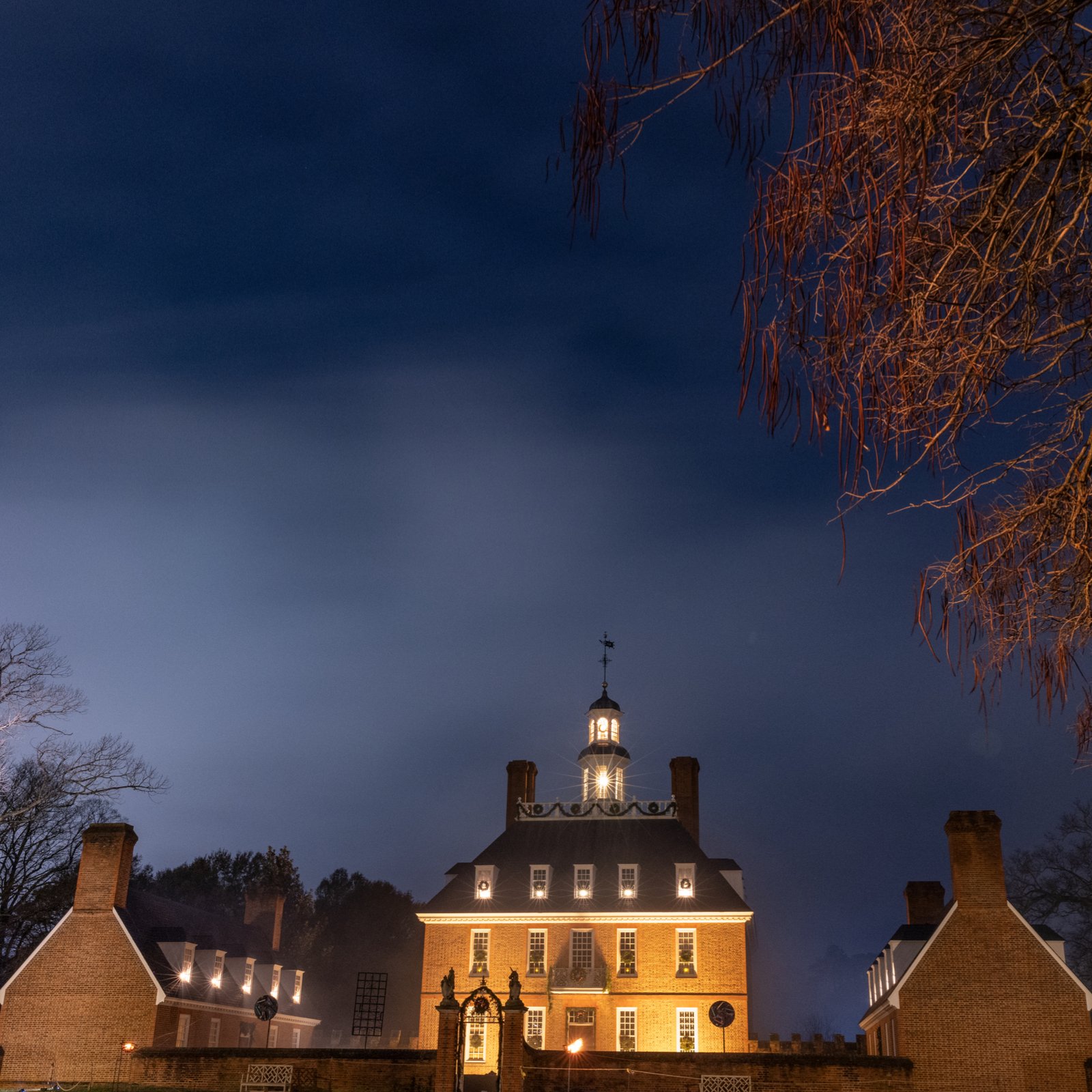 An image of the Governors Palace illuminated at night.