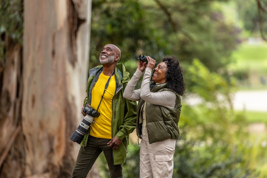 Couple Bird Watching While Hiking