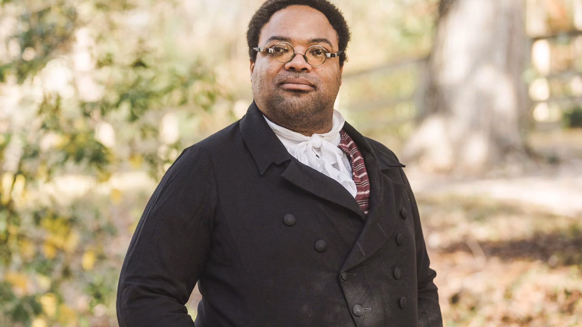 An interpreter dressed as James Armistead Lafayette faces forward.