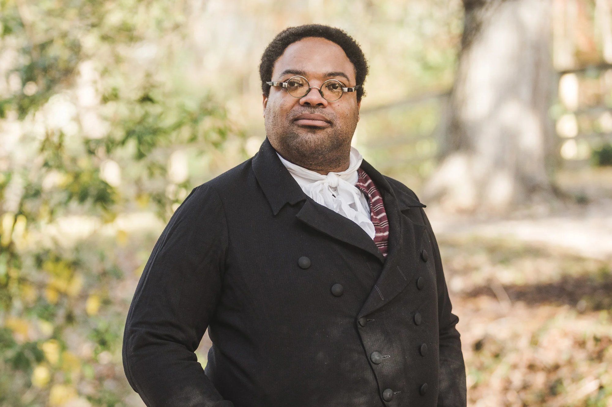 An interpreter dressed as James Armistead Lafayette faces forward.