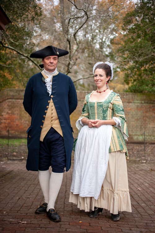 Interpreters dressed as George and Martha Washington pose for the camera.